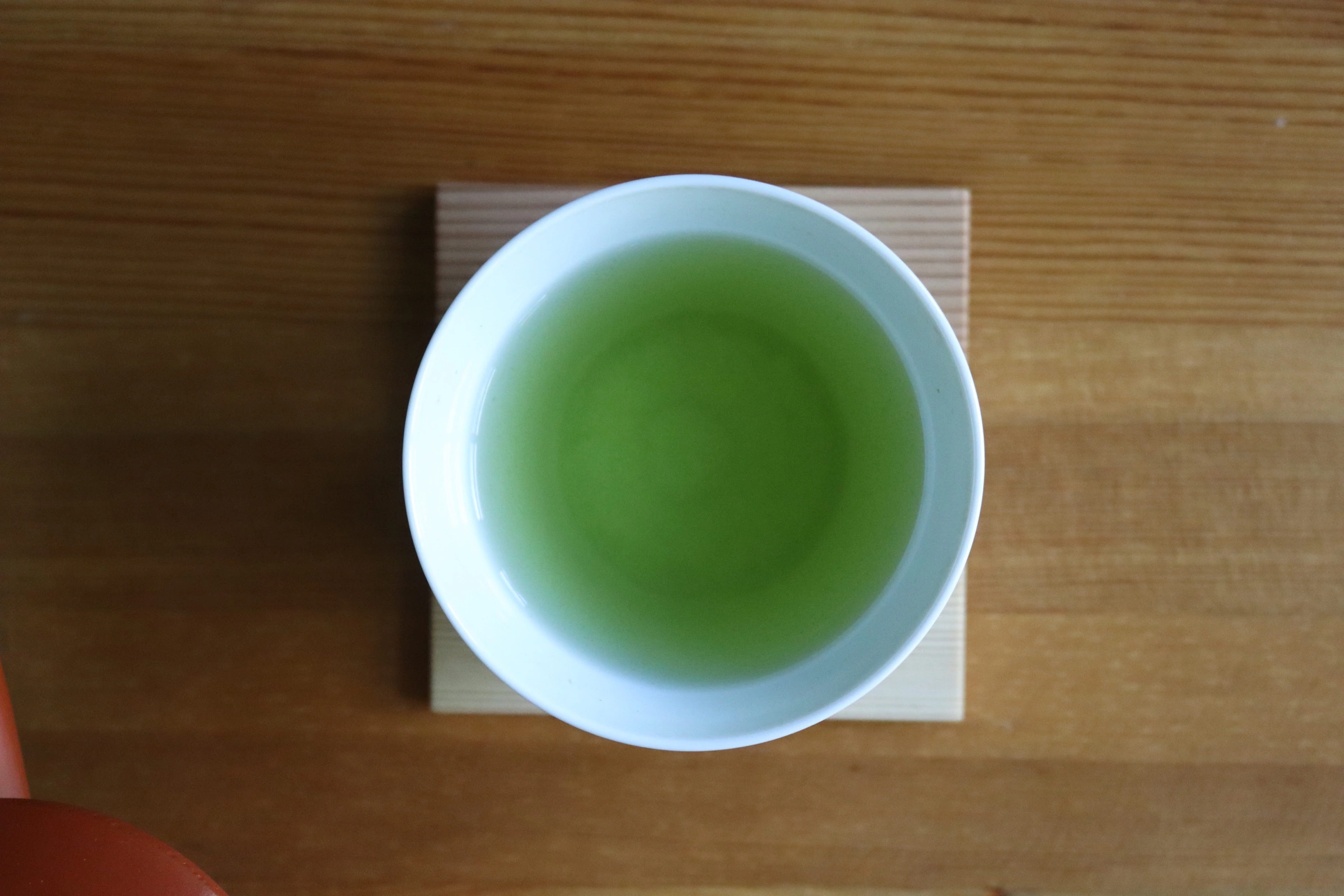 Japanese green tea in a white cup